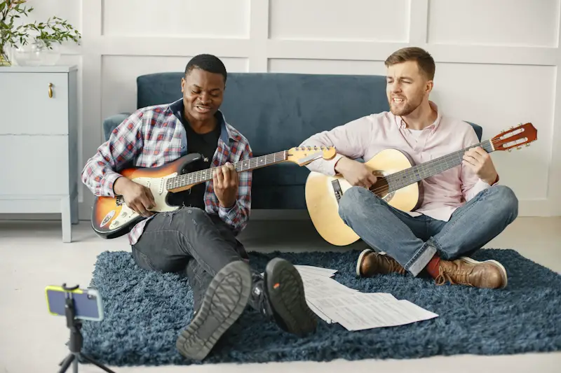 2 guys playing guitar and singing