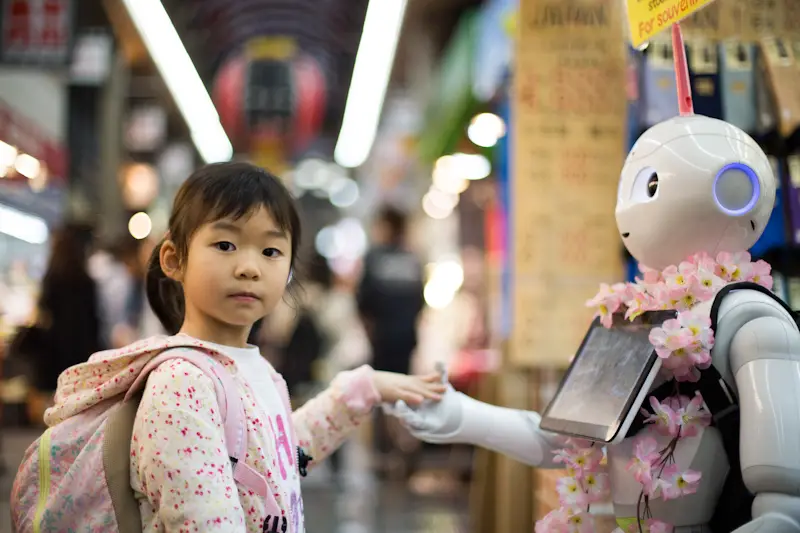 child holding hands with AI friendly robot
